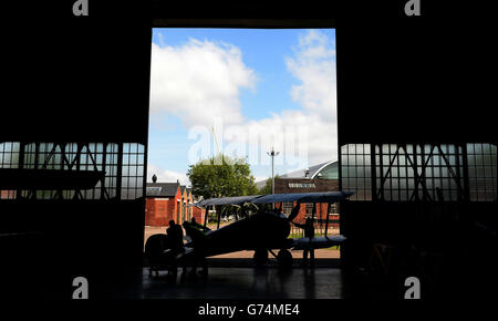 A First World War Sopwith Camel Bi-plane is wheeled into the new exhibition space dedicated to telling the story of the First World War In The Air at the RAF Musuem, London. Stock Photo