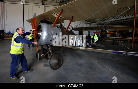A First World War Sopwith Camel Bi-plane is wheeled into the new exhibition space dedicated to telling the story of the First World War In The Air at the RAF Musuem, London. Stock Photo