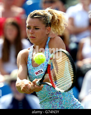 Tennis - AEGON International 2014 - Day Two - Devonshire Park. Camila Giorgi returns to Victoria Azarenka during the AEGON International at Devonshire Park, Eastbourne. Stock Photo