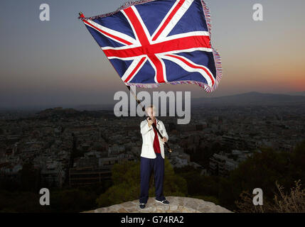 British Judo competitor Kate Howey from Andover, Hampshire, holds the British flag aloft in Athens, Greece. Kate will carry the flag and lead the team during Friday evening's opening ceremony for the 2004 Olympic Games. Stock Photo