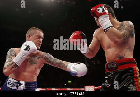 Ricky Burns (left) and Dejan Zlaticanin during the vacant WBC International lightweight title at the Braehead Arena, Glasgow. PRESS ASSOCIATION Photo. Picture date: Friday June 27, 2014. Photo credit should read: Danny Lawson/PA Wire Stock Photo