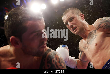 Boxing - Braehead Arena. Ricky Burns (righ) and Dejan Zlaticanin during the vacant WBC International lightweight title at the Braehead Arena, Glasgow. Stock Photo