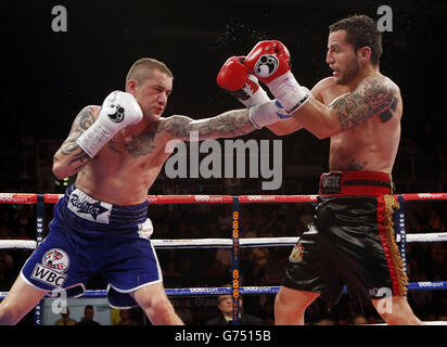 Boxing - Braehead Arena. Ricky Burns (left) and Dejan Zlaticanin during the vacant WBC International lightweight title at the Braehead Arena, Glasgow. Stock Photo