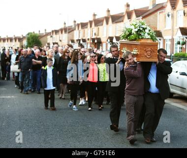 The coffin of Gerry Conlon, who was wrongly convicted of the 1974 IRA Guildford pub bombing, is carried to St Peter's Cathedral, Belfast, for his funeral. Stock Photo