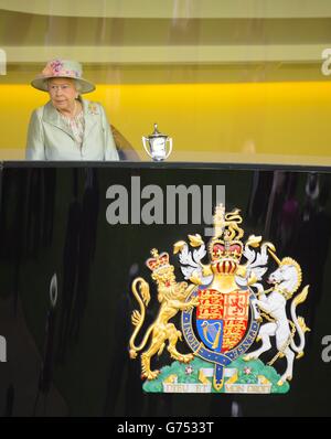 Queen Elizabeth II takes her seat in the Royal Box during Day Two of the 2014 Royal Ascot Meeting at Ascot Racecourse, Berkshire. Stock Photo