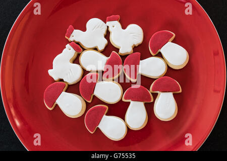 Homemade red and white butter cookies in red plate Stock Photo