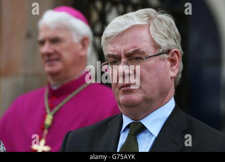 Tanaiste Eamon Gilmore attends the funeral of Gerry Conlon, who was wrongly convicted of the 1974 IRA Guildford pub bombing, at St Peter's Cathedral, Belfast. Stock Photo