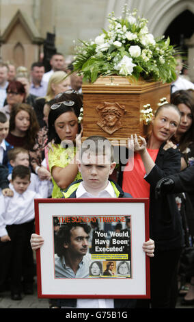 The coffin of Gerry Conlon, who was wrongly convicted of the 1974 IRA Guildford pub bombing, is carried from St Peter's Cathedral, Belfast, following his funeral. Stock Photo