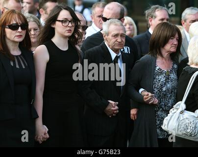 Birmingham Six member Paddy Hill and sister of Gerrry Conlon, Ann McKernan (right) follow the coffin of Gerry Conlon, who was wrongly convicted of the 1974 IRA Guildford pub bombing, to St Peter's Cathedral, Belfast, for his funeral. Stock Photo
