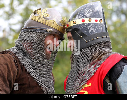 Roy Ramsey as Robert The Bruce(left) squares up to Paul Gamble as King Edward the second from The Clanranald Trust, as they prepare for Battle of Bannockburn re-enactment performance at the Bannockburn Live Event in Bannockburn, which marks the 700th anniversary of the battle. Stock Photo