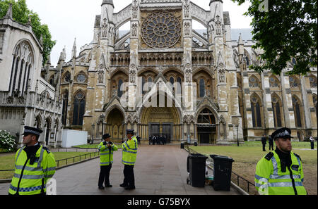 1 billion in tax protest outside Westminster Abbey, London. PRESS ASSOCIATION Photo. Picture date: Saturday June 28, 2014. The chemist has denied the claims, saying they are 'simply not true' because 'the number is based on inaccurate and theoretical calculations.' But this afternoon anti-tax avoidance group UK Uncut said hundreds of people were demonstrating outside Boots shops in Liverpool, Manchester, Northampton, Ashford, Penarth, and in Victoria Street, London. They added that campaigners would be moving to a 'secret location' later today for more protests. See PA story PROTEST Boots. Stock Photo