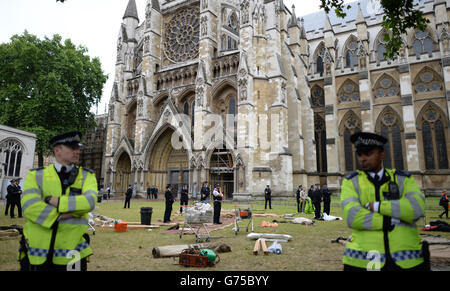 1 billion in tax protest outside Westminster Abbey, London. PRESS ASSOCIATION Photo. Picture date: Saturday June 28, 2014. The chemist has denied the claims, saying they are 'simply not true' because 'the number is based on inaccurate and theoretical calculations.' But this afternoon anti-tax avoidance group UK Uncut said hundreds of people were demonstrating outside Boots shops in Liverpool, Manchester, Northampton, Ashford, Penarth, and in Victoria Street, London. They added that campaigners would be moving to a 'secret location' later today for more protests. See PA story PROTEST Boots. Stock Photo