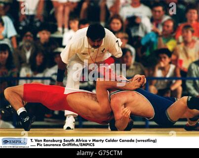Athletics - Commonwealth Games - Canada - 1994. T. Van Rensburg South Africa v Marty Calder Canada {wrestling} Stock Photo