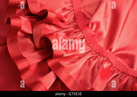 Ruffles and seams of a red garment or dress Stock Photo