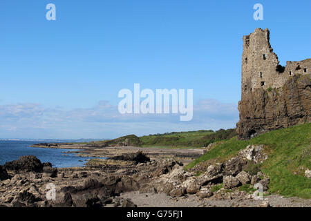 View north past the ruins of Dunure castle on a rocky promontory on the Carrick coastline at Dunure in South Ayrshire, Scotland Stock Photo