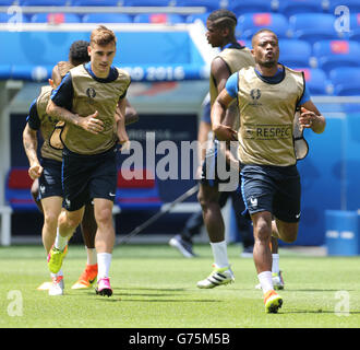 France's Antoine Griezmann and Patrice Evra during a training session at the Stade des Lumieres, Lyon. Stock Photo