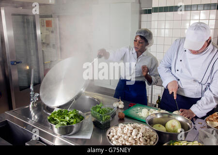 Preparations for lunch in a commercial kitchen. Stock Photo