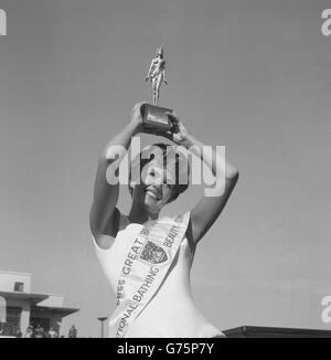 Holding her trophy high in the air is 24-year-old Joy Black, of Loch Foot, Dumfries, Scotland, who yesterday was crowned Miss Great Britain held at Morecambe, Lancashire. Stock Photo