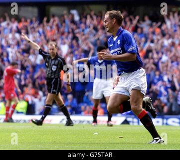 Ronald de Boer celebrates scoring against Aberdeen during their Bank of Scotland Premier League match at Rangers' Ibrox Stadium in Glasgow. Stock Photo