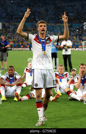 Germany's Thomas Muller celebrates on the pitch after lifting the FIFA World Cup 2014 Trophy Stock Photo
