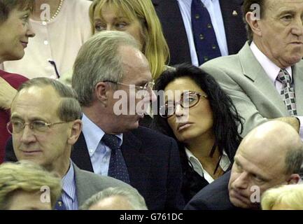 England's soccer team manager Sven-Goran Eriksson with his partner Nancy Dell'Olio (R) watching the Davis Cup match between Great Britain's Tim Henman and Sweden's Jonas Bjorkman in the opening round of their World Group match. * ... at the National Indoor Arena, Birmingham. 19/04/02 England coach Sven Goran Eriksson with his former partner Nancy Dell'Olio (right). According to the daily Mirror the England supremo has formed a friendship with television presenter Ulrika Jonsson. Ms Jonsson's agent Melanie Cantor said neither she nor Ulrika would comment and Paul Newman, head of Communications Stock Photo
