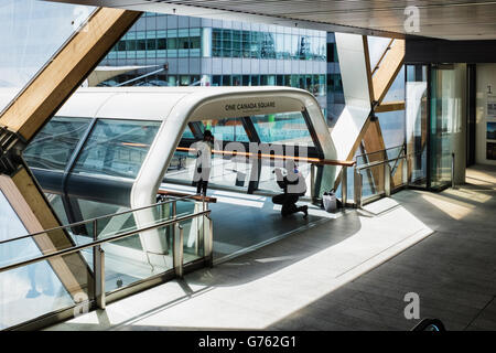 Photographer in Crossrail walkway connecting New Crossrail Railway Station Building to One Canada Square, London, Canary Wharf Stock Photo