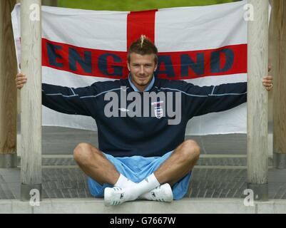 England's David Beckham relaxes in the Japanese Water Gardens in Awaji, Japan, ahead of their first World Cup Game against Sweden on Sunday. 23/05/03 Football and fashion icon David Beckham is as British as the Union Jack, according to a poll released today. The nation s young adults voted the soccer star and the red, white and blue flag the joint top symbols of a modern Britain - ahead of a traditional feast of fish and chips, country pubs and the royal family. The Manchester United star, who captains England, received 17% of votes from 25- to 34-year-olds when asked who or what best Stock Photo