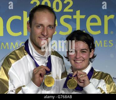 England's Simon Archer and Jo Goode with their gold medals after winning the mixed doubles final in badminton at the Bolton Arena, during the XVII Commonwealth Games. 12/06/04: Simon Archer and Jo Goode (R) who have been awarded a MBE (Member of the Order of the British Empire), in the Queen's Birthday Honours List Stock Photo