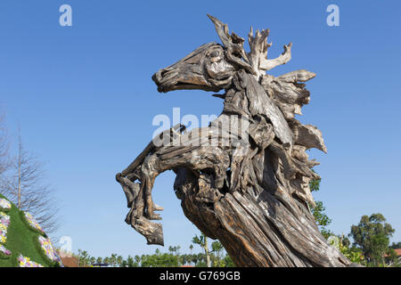 wooden horse sculpture statue in park Stock Photo