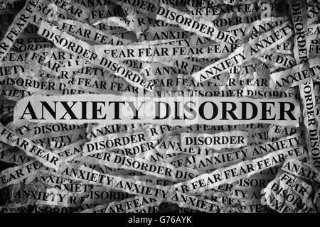 Anxiety Disorder. Torn pieces of paper with the words Anxiety Disorder. Concept Image. Black and White. Closeup. Stock Photo