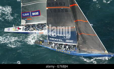 Great Britain's America's Cup team GBR Challenge aboard Wight Lightning (left) get a little too close to the American OneWorld yacht USA-67 at the start of their race in the Hauraki Gulf off Auckland, New Zealand. Team GBR incurred a 360 degree penalty turn after hitting USA-67 at the start and eventually finished three minutes 22 seconds after their opponents. Stock Photo