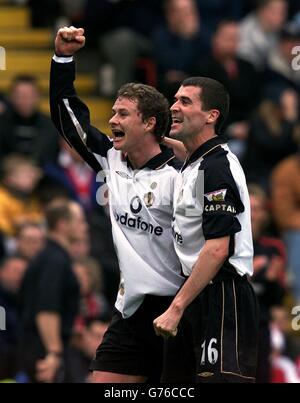 Manchester United's Ole Gunnar Solksjaer (left) celerbates with Roy Keane after scoring his and United's second goal in the Barclaycard Premiership matchh against Charlton at the Valley ground. Manchester United won the game 2-0. Stock Photo
