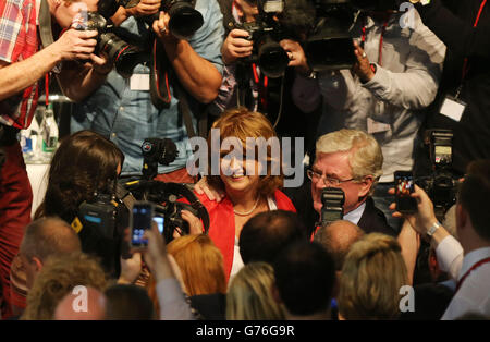 New leader of the Irish Labour party Joan Burton is congratulated by former leader Eamon Gilmore at the Mansion House in Dublin following the count for the leadership elections. Stock Photo