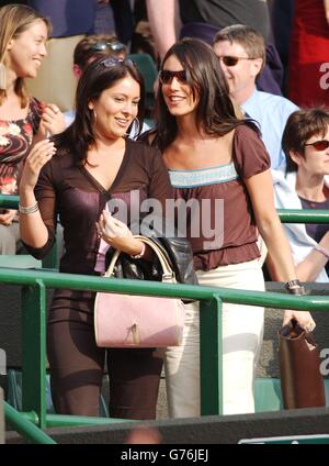 Lucy Rusedski, (right) wife of british tennis player Greg Rusedski watches her husband beat Jurgen Melzer of Germany on Court One at Wimbledon the first day of The Championships. Rusedski, the number 23 seed beat Melzer 6:1/6:4/7:5. Stock Photo