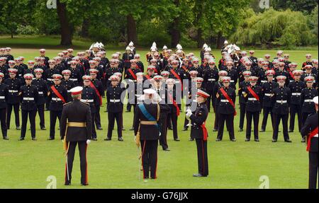 The Duke of Edinburgh (front centre) salutes Royal Marine Cadets marching as he presented them with a new colour at a 350th Foundation day parade, in the garden of Buckingham Palace, London. Stock Photo