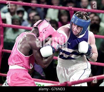 England's Paul Smith lands a right, during his bout where he gained at least a Bronze medal in the 71kg Lightwelter division Quarter-final against Thomas Awimbono from Ghana in the Commonwealth Games, at the Wythenshawe Forum Centre, Manchester. Stock Photo