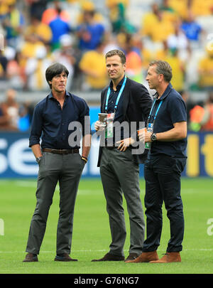Soccer - FIFA World Cup 2014 - Semi Final - Brazil v Germany - Estadio Mineirao. Germany's assistant coach Hans-Dieter Flick (right), head coach Joachim Loew (left) and team manager Oliver Bierhoff Stock Photo