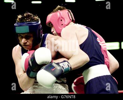 Victorious England boxer Paul Smith (left) throws a left as Scotland's Craig McEwan tries to land a punch in a scrappy semi-final at 71kg Light-Middleweight. The win put Smith into Saturday's Commonwealth Games final against Canadian Jean Thenistor Pascal, at Manchester Evening News Arena. Stock Photo