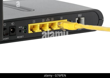foreground of network ports with a network cable connected Stock Photo