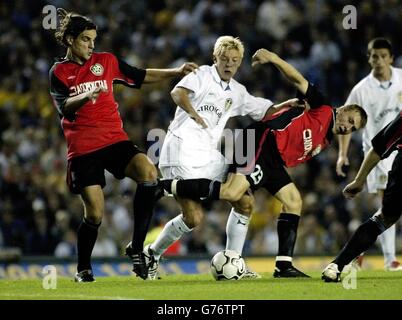 Leeds United's Alan Smith is held back by a wall of FC Metalung Zaporizhzhya defencers, during their UEFA cup game at Elland Road, Leeds. Stock Photo