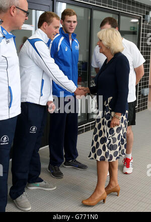 The Duchess of Rothesay, Chancellor of Aberdeen University shakes hands with Scottish Commonwealth Games swimmer Robbie Renwick watched by fellow swimmer Jack Ness (blue top) as she tours the new Aquatics Centre before officially opening the new Aquatics Centre at Aberdeen Sports Village. Stock Photo