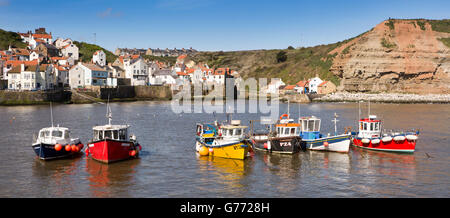 UK, England, Yorkshire, Staithes, fishing boats moored in the harbour, panoramic Stock Photo