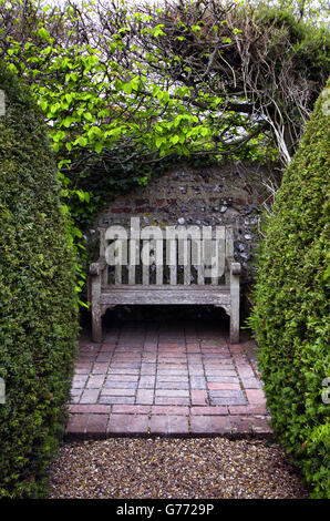 A cosy nook in the formal garden of the Clergy house in Alfriston, East Sussex, UK Stock Photo