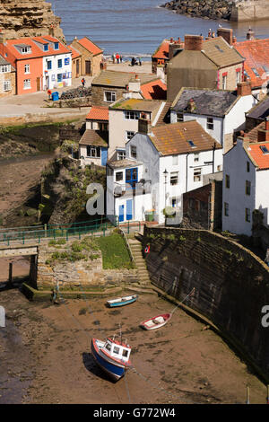 UK, England, Yorkshire, Staithes, elevated view of boats in Staithes Beck at low tide Stock Photo