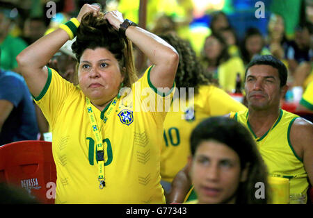 Soccer - FIFA World Cup 2014 - Quarter Final - Brazil v Colombia - Brazil Fans in Salvador. A Brazil fan stresses as she watches game Stock Photo