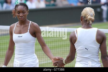 EDITORIAL USE ONLY, NO COMMERCIAL USE. Serena (left) and her sister Venus Williams from the USA play their Ladies' Doubles Semi-Final less than two hours after playing each other in the Ladies' Singles Final at Wimbledon. * It is the first time in 118 years that sisters have met in the final at Wimbledon. Serena won in straight sets 7:6/6:3. Their doubles opponents were Anna Kournikova from Russia and Chanda Rubin from America. Stock Photo