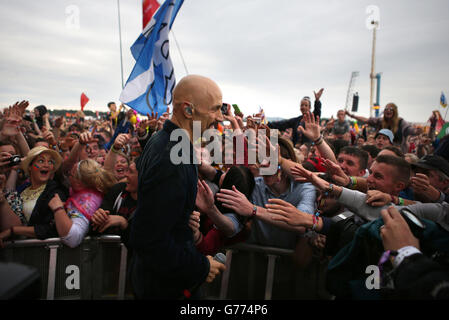 Tim Booth from the band James greets the crowd on the main stage at T in the Park music Festival at Kinross. Stock Photo