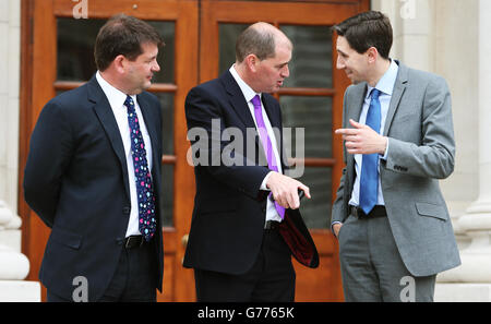 Taoiseach Simon Harris (centre), Minister Martin Heydon (right) and ...