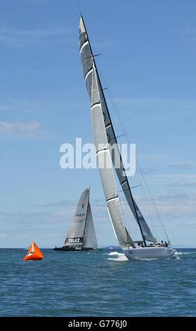 Britain's America's Cup team GBR Challenge (right) tack across the Swedish Victory Challenge yacht in the Hauraki Gulf off Auckland, New Zealand. *...Wight Lightning sped away from the start after forcing the Swedes across the line before the gun making the black boat complete a 360 degree penalty turn. GBR maintained the lead and came home victors by 48 seconds. It gives the team their second win in the first round of the Louis Vuitton Cup, suprising many. Stock Photo