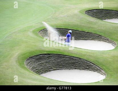Golf - The Open Championship 2014 - Day Two - Royal Liverpool Golf Club. England's Justin Rose chips out of a bunker during day two of the 2014 Open Championship at Royal Liverpool Golf Club, Hoylake. Stock Photo